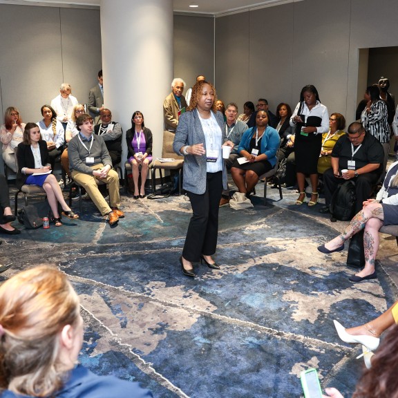 Blanche Jackson, CEO of Stepping Stones Community presenting at a small group breakout session