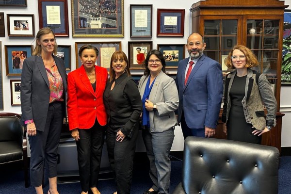 Rep Nydia Velazquez in her office with Inclusiv staff and board members