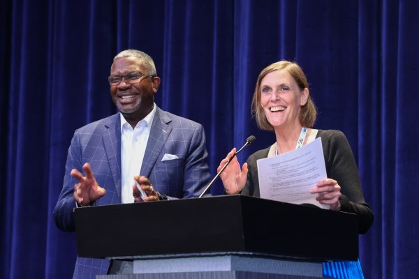 Inclusiv CEO Cathie Mahon and TruStage CEO Terrance Williams on stage together at Inclusiv's 50th anniversary conference