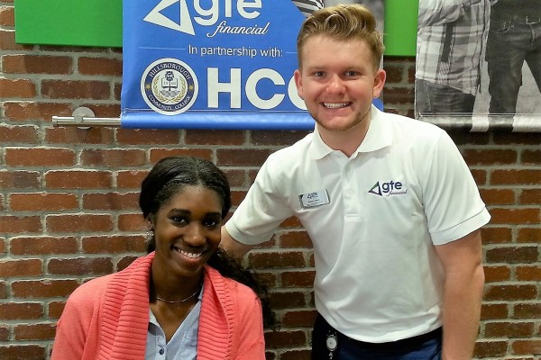 GTE staff members posing at a community event