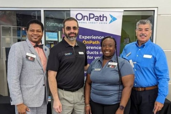 OnPath FCU staff pose in front of a branch location
