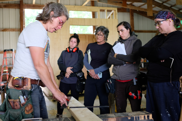 A group watches a demo by Hammerstone (Alternatives CU)