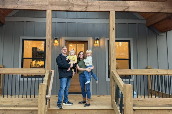 Copper Basin CU members in front of their newly purchased home